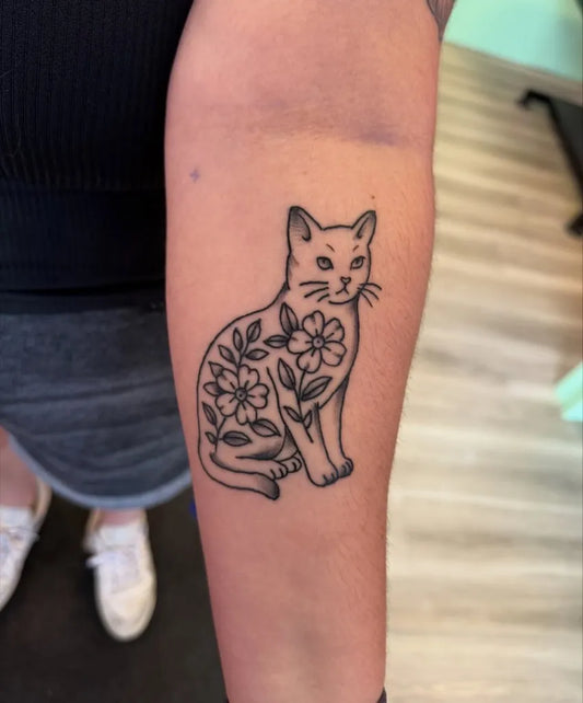 Medium Linework Cat with Flowers Tattoo on Women Arm by @tattooingbarbie