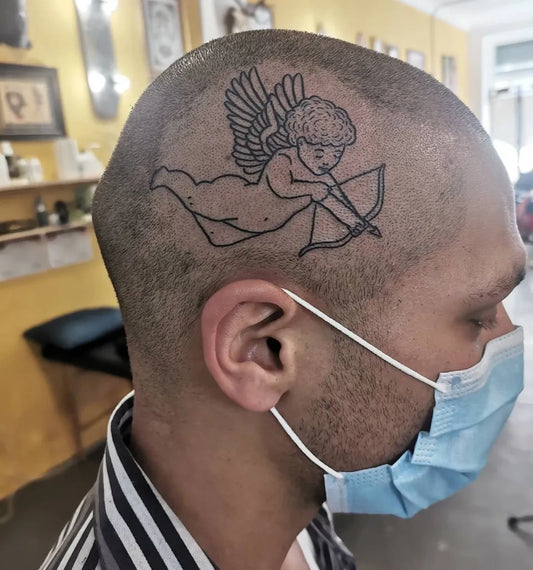 Medium Linework Cherub Tattoo on Men Head by @hilaryrandle