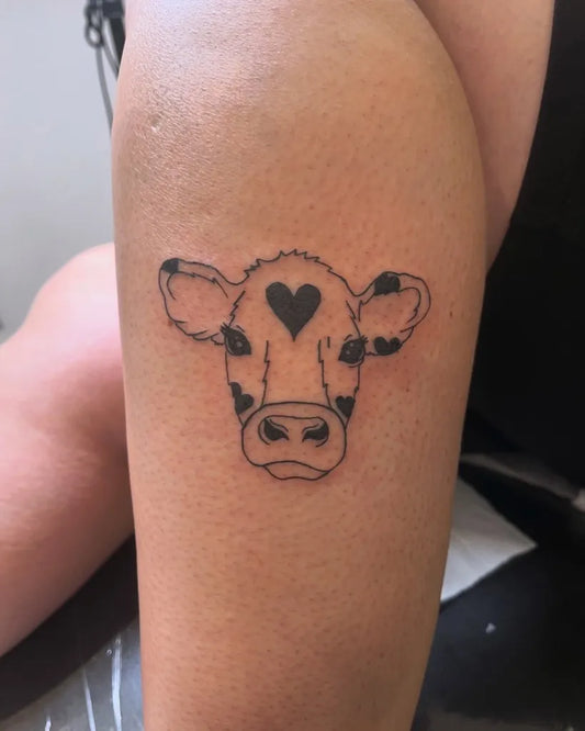 Medium Linework Cow Face on Women Thigh Tattoo by @inked_byjaz_