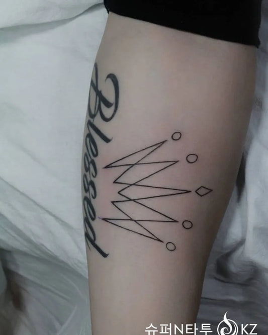 Medium Linework Crown and Blessed Tattoo on Women Thigh by @supernkz23