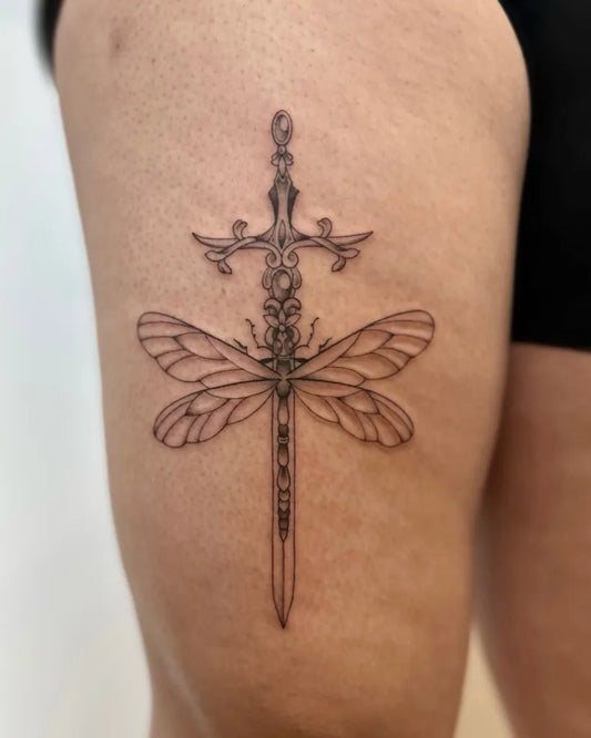 Medium Linework Dragonfly Sword on Women Thigh Tattoo by @bycristaliana