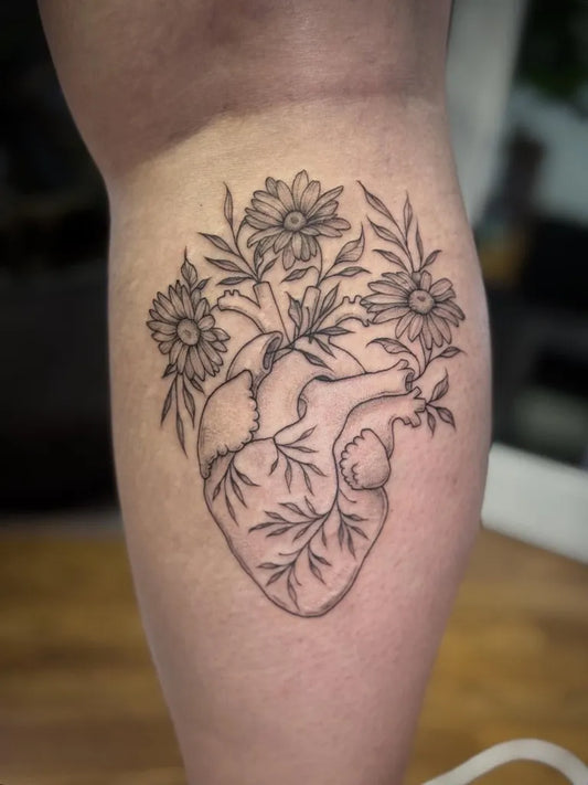 Medium Linework Heart with Daisies on Women Thigh Tattoo by @natts_tatts