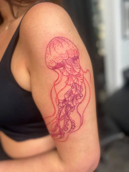 Medium Linework Jellyfish Tattoo on Women Shoulder by @organicinktattoo