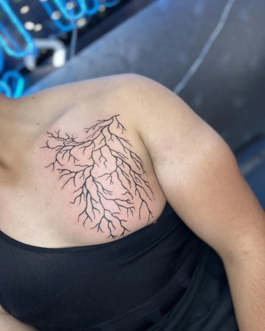 Medium Linework Lightning Bolt Tattoo on Women Shoulder by @gay_penguin_piercing_tattoo