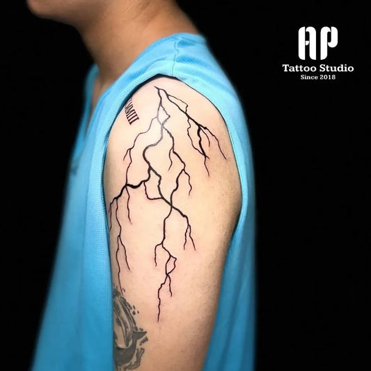 Medium Linework Lightning Tattoo on Men Shoulder by @aptattoostudio