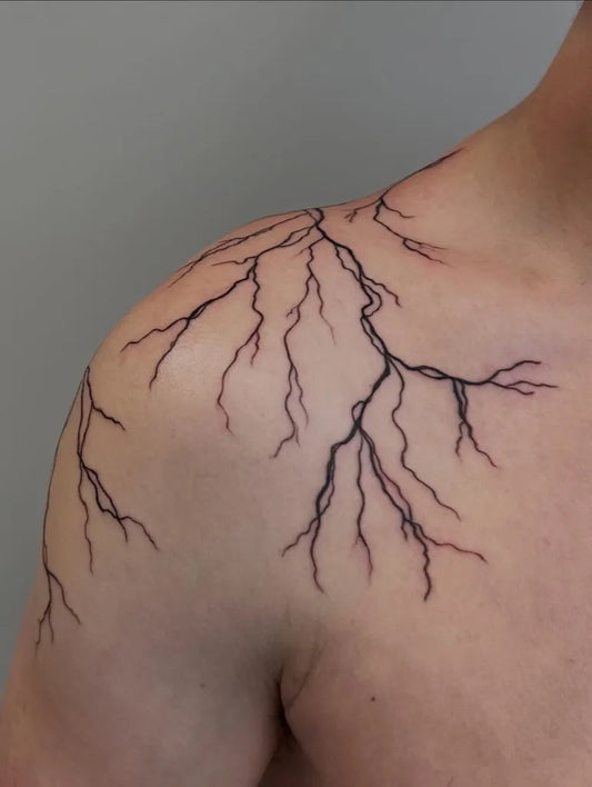 Medium Linework Lightning Tattoo on Men Shoulder by @sasiyaink