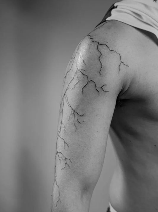 Medium Linework Lightning Tattoo on Men Shoulder by @soja.ttt