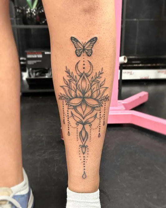 Medium Linework Lotus Flower Butterfly Moon on Women Leg Tattoo by @miastattoos