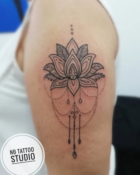Medium Linework Lotus Flower with Drapes on Women Upper Arm Tattoo by @nbtattoostudio