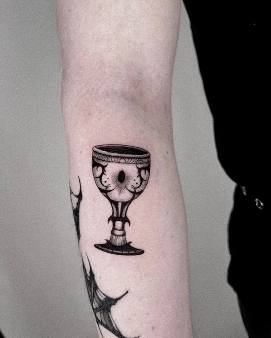 Medium Linework Ornate Chalice on Women Arm Tattoo by @maugrimm.ink