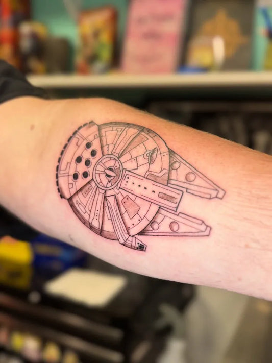 Medium Linework Star Wars Millennium Falcon Tattoo on Men Arm by @supriyasongtattoos