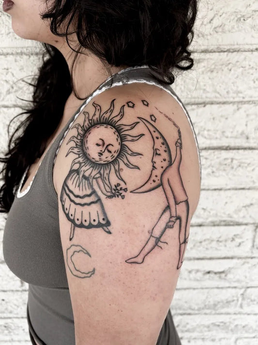 Medium Linework Sun Moon and Figure on Women Shoulder Tattoo by @tazebeth