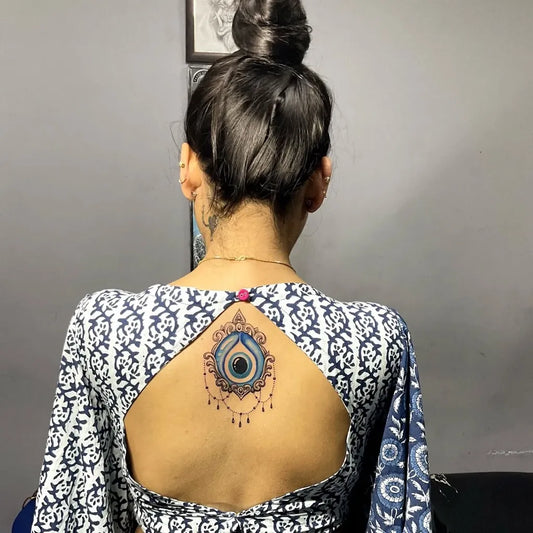 Medium Mandala Evil Eye on Women Back Tattoo by @surajit_freak_of_ink