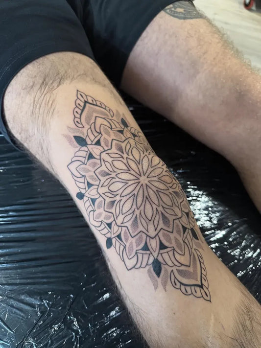 Medium Mandala Flower Tattoo on Men Knee by @kaylareevestattoo