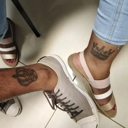 Medium Matching Crown Tattoo on Couple Ankle by @thetattooguy_ls