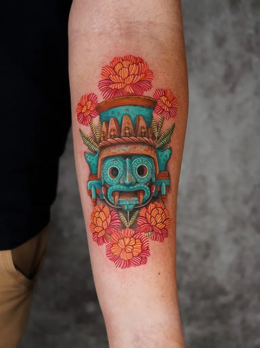 Medium Mexican Folk Art Aztec Mask with Marigolds Tattoo on Women Arm by @fertattoo2406
