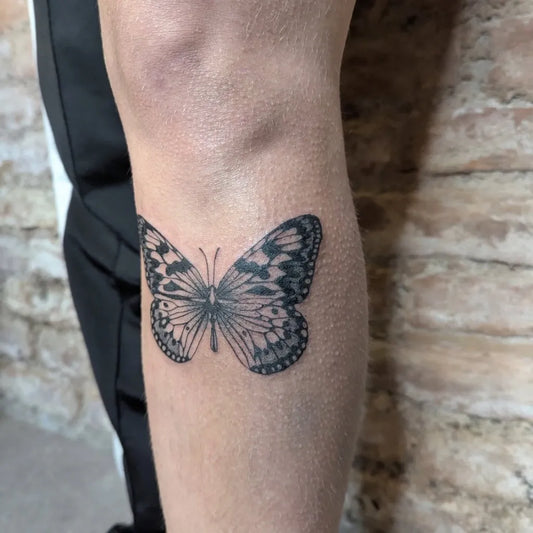 Minimalist Butterfly on Men Knee Tattoo by @eva.ahoi.tattoo