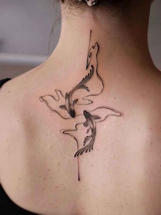 Medium Minimalist Koi Fish Tattoo on Women Back by @solyn_tattooist