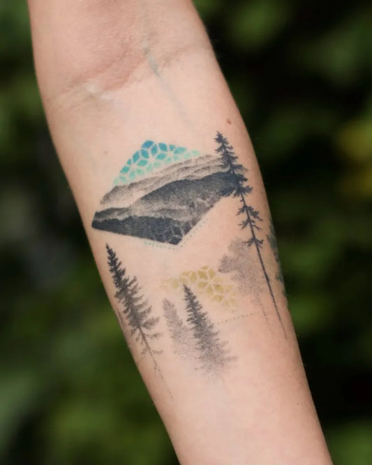 Medium Minimalist Mountain Forest Tattoo on Women Forearm by @pejczi