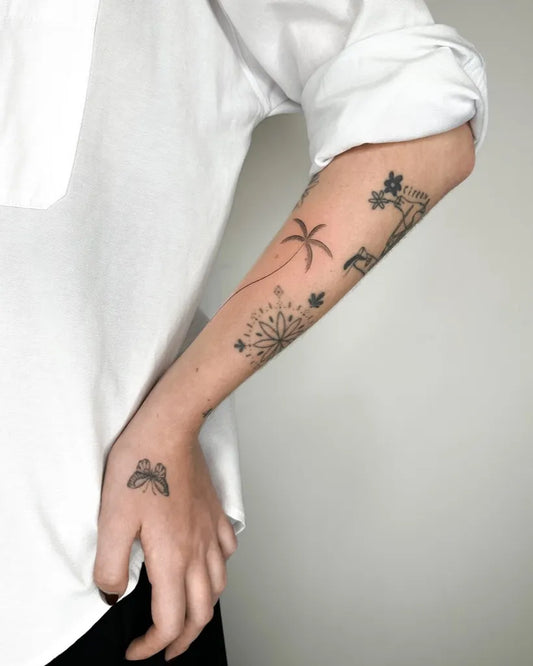 Medium Minimalist Palm Tree Butterfly Dandelion Tattoo on Women Arm by @dylanlongcho