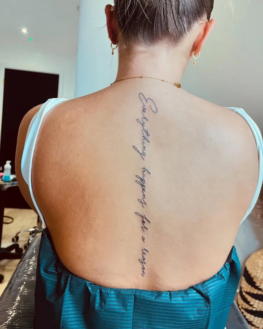 Medium Minimalist Quote on Women Back Tattoo by @inked_byjaz_
