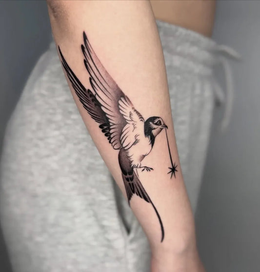 Medium Minimalist Swallow Bird with Star on Men Arm Tattoo by @entala_tattoo