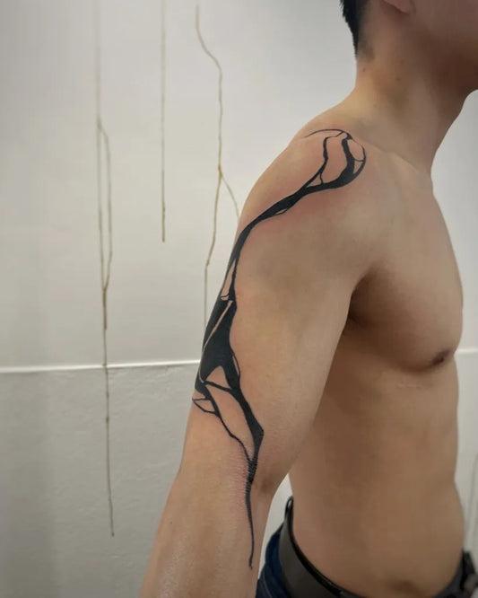 Medium Negative Space Branch Tattoo on Men Shoulder by @sanne_vaghi
