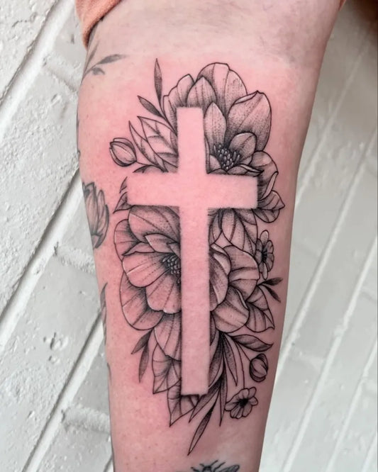 Medium Negative Space Cross with Poppies Tattoo on Women Arm by @paycheck.tattoos