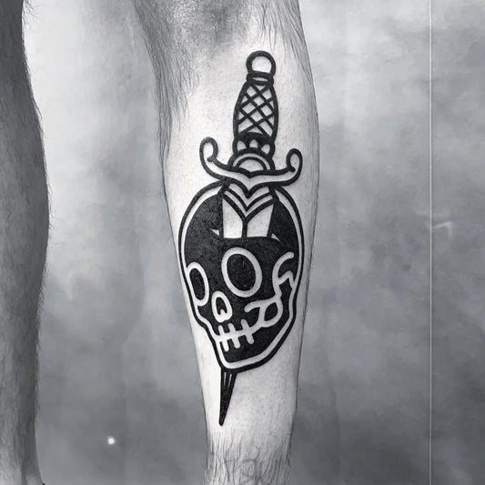 Medium Negative Space Dagger Skull Tattoo on Men Leg by @mubodyarts