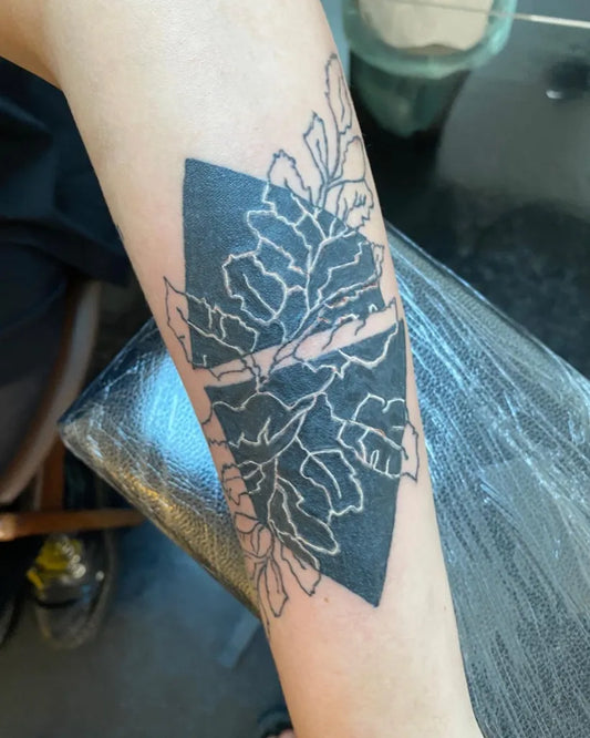 Medium Negative Space Diamond Floral Tattoo on Women Arm by @pretty.f.tattoos