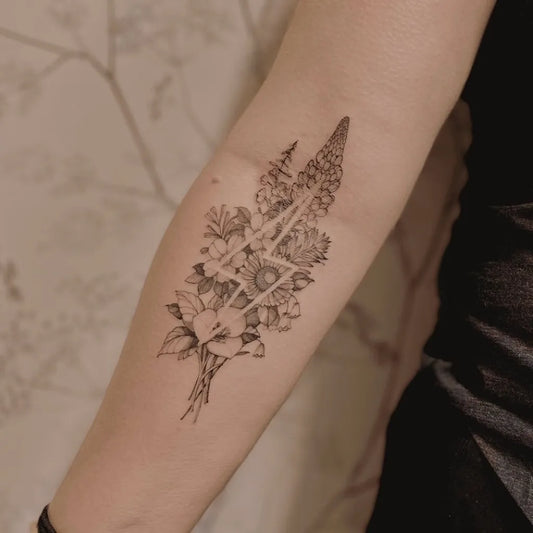 Medium Negative Space Foxglove Flower Bouquet Tattoo on Women Forearm by @iamthepaintedlady