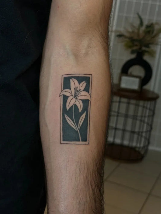 Medium Negative Space Lily Flower Tattoo on Men Arm by @_alyssa_mua