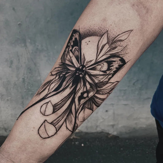 Medium Negative Space Moth and Flowers Tattoo on Women Arm by @lynn.ivarsson