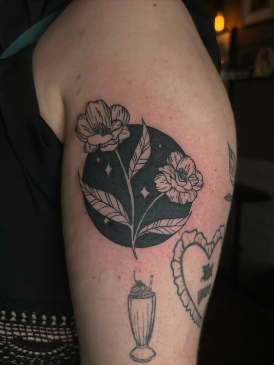 Medium Negative Space Poppies and Milkshake Tattoo on Women Arm by @tywalkertattoos
