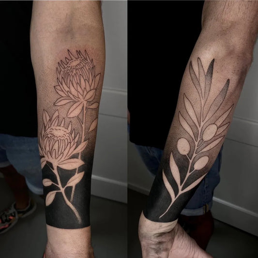 Medium Negative Space Proteas and Olives Tattoo on Men Arm by @pimientanegra_tattoo