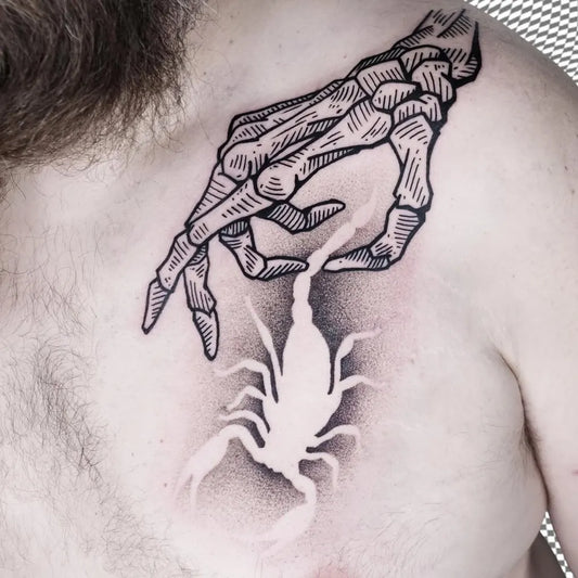 Medium Negative Space Skeleton Hand Holding Scorpion Tattoo on Men Shoulder by @justinkd_tatts