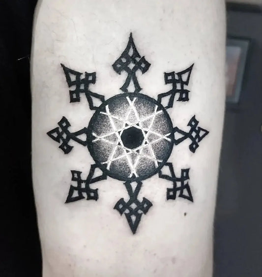 Medium Negative Space Snowflake Tattoo on Men Arm by @ophelia.tattoo