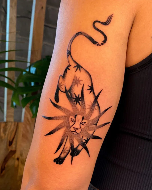Medium Negative Space Star Lion Tattoo on Women Arm by @spirit.of.salt