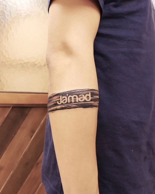 Medium Negative Space Word Tattoo on Men Arm by @irislamht