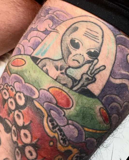 Medium Neo Traditional Alien UFO Tattoo on Men Thigh by @tattooingbysamuel