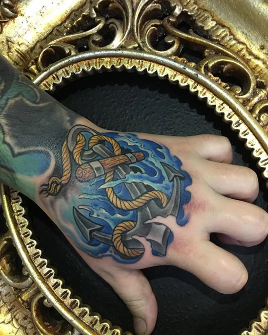 Medium Neo Traditional Anchor and Rope Tattoo on Men Hand by @thewarrentattoo