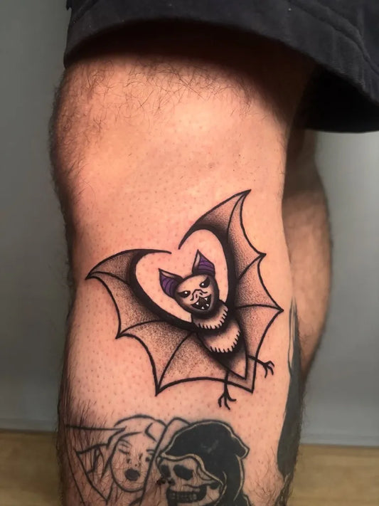 Medium Neo Traditional Bat Heart Tattoo on Men Knee by @saandramust.ink