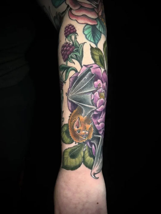 Medium Neo Traditional Bat and Peony Women Arm by @ashesandthorns
