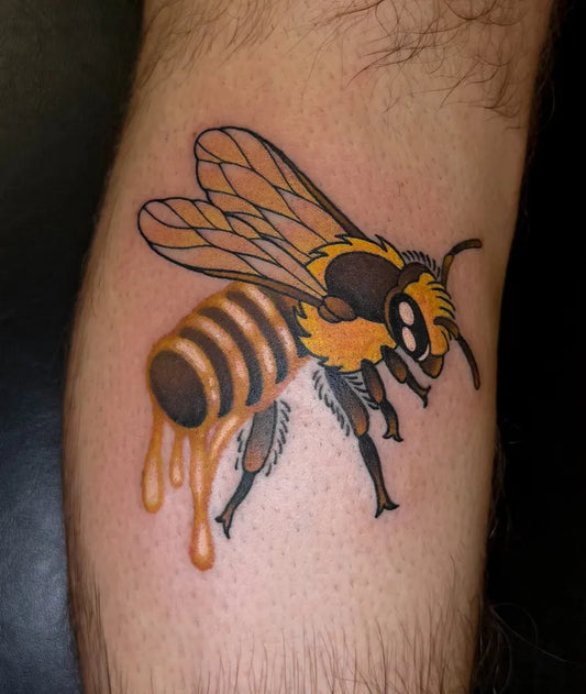 Medium Neo Traditional Bee with Honey on Men Leg Tattoo by @celiart_tattoo