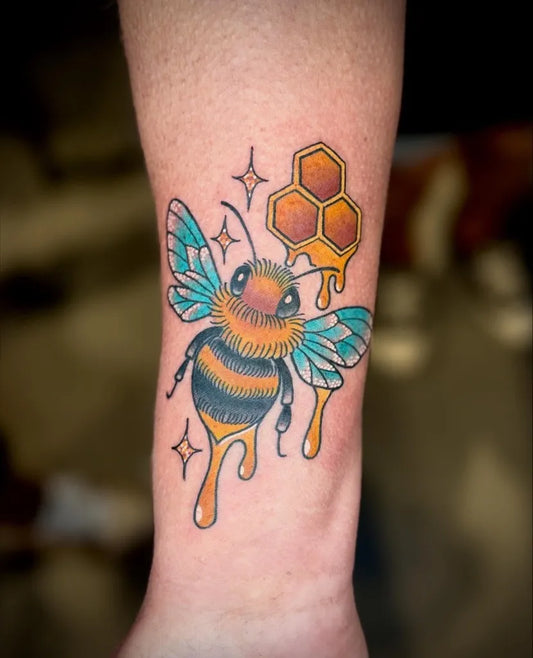 Medium Neo Traditional Bee with Honeycomb on Women Arm Tattoo by @christinatattooer