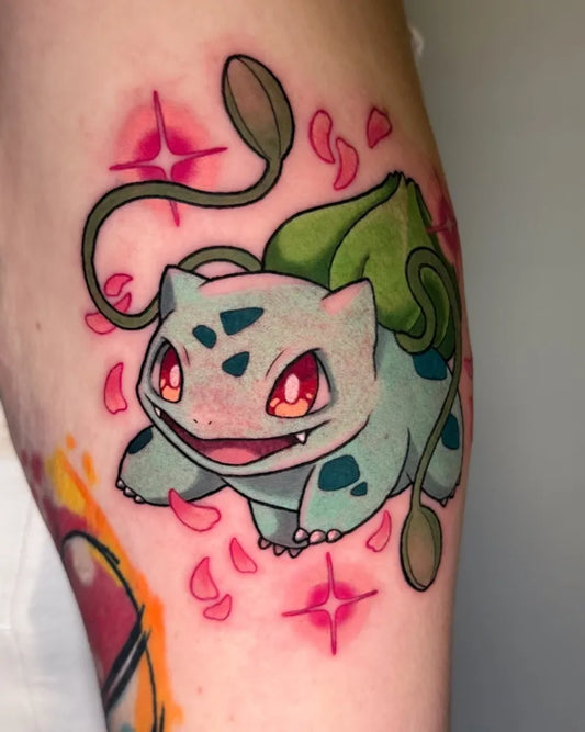Medium Neo Traditional Bulbasaur with Cherry Blossoms and Stars Tattoo on Women Arm by @saga.inks
