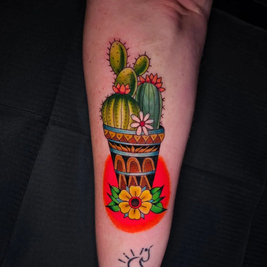 Medium Neo Traditional Cactus in Pot with Flowers Tattoo on Women Arm by @lordnugs