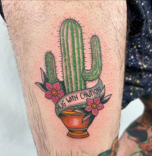 Medium Neo Traditional Cactus with Hug Banner and Flowers Tattoo on Men Leg by @acworthtattoo