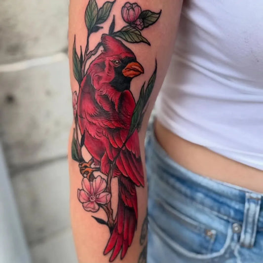 Medium Neo Traditional Cardinal and Flowers Tattoo on Women Arm by @blueherontattoos