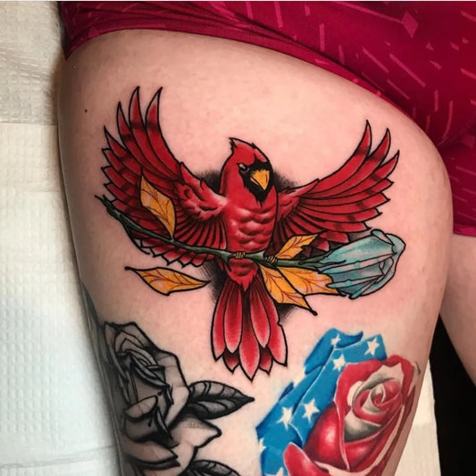 Medium Neo Traditional Cardinal with Flowers Tattoo on Women Thigh by @lucky13tattoos